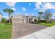Charming single-Gathering home with a manicured lawn and a three-car garage at 12423 Blue Hill Trl, Lakewood Ranch, FL 34211