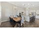 Bright kitchen with modern appliances, granite countertops, and open dining area at 12423 Blue Hill Trl, Lakewood Ranch, FL 34211