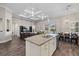 Spacious kitchen with a large island, stainless steel dishwasher, and open layout to the living room at 12423 Blue Hill Trl, Lakewood Ranch, FL 34211