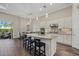 Elegant kitchen with granite countertops, pendant lighting, stainless steel appliances, and adjacent dining area at 12423 Blue Hill Trl, Lakewood Ranch, FL 34211