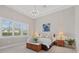 Bright primary bedroom with large windows and neutral decor at 12423 Blue Hill Trl, Lakewood Ranch, FL 34211