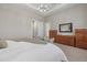 Bright primary bedroom with hardwood furniture and multiple closets at 12423 Blue Hill Trl, Lakewood Ranch, FL 34211