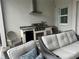 Outdoor kitchen with stainless steel BBQ grill, refrigerator, and sink at 12423 Blue Hill Trl, Lakewood Ranch, FL 34211