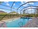 Refreshing pool and hot tub with screened enclosure and beautiful backyard views at 12423 Blue Hill Trl, Lakewood Ranch, FL 34211