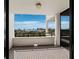 Spacious tiled balcony with stunning views of the city skyline and waterfront at 1255 N Gulfstream Ave # 407, Sarasota, FL 34236