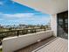 Relaxing balcony view of the water, city, and palm trees at 1255 N Gulfstream Ave # 407, Sarasota, FL 34236