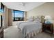 Bright bedroom with two twin beds, a large window, and water views at 1255 N Gulfstream Ave # 407, Sarasota, FL 34236