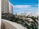 Exterior view of the building and surrounding trees at 1255 N Gulfstream Ave # 407, Sarasota, FL 34236