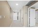 Hallway featuring tile floors, neutral paint, and multiple doors at 1255 N Gulfstream Ave # 407, Sarasota, FL 34236