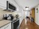 Efficient kitchen featuring stainless steel appliances and granite countertops at 1255 N Gulfstream Ave # 407, Sarasota, FL 34236