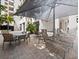 Relaxing outdoor lounge area with lounge chairs, dining tables, and shade umbrellas at 1255 N Gulfstream Ave # 407, Sarasota, FL 34236