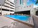 Refreshing outdoor pool area with modern lounge chairs and a sleek, minimalist design at 1255 N Gulfstream Ave # 407, Sarasota, FL 34236
