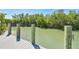 Waterfront home with a private dock featuring sturdy wooden posts and convenient boat mooring hardware at 1708 Wharf Rd, Sarasota, FL 34231