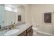 Bathroom with a granite countertop, modern sink fixtures, and neutral wall colors at 1774 Woodleaf Hammock Ct, Bradenton, FL 34212