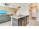 Kitchen island featuring granite countertops, stainless steel appliances, and seating at 1774 Woodleaf Hammock Ct, Bradenton, FL 34212