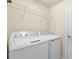 A well-equipped laundry room, complete with modern washer and dryer units, and an ironing board at 207 Red Fox Ct # 101, Bradenton, FL 34212