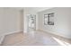 Empty bedroom featuring light wood floors, a sliding mirror closet and a window at 216 68Th St Nw, Bradenton, FL 34209