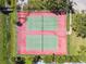 Aerial view of well-maintained community tennis courts surrounded by lush landscaping at 2311 14Th W Ave # 108, Palmetto, FL 34221