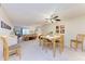 Inviting living area with a large ceiling fan seamlessly integrates the dining and seating spaces at 3176 Lake Bayshore Dr # 319, Bradenton, FL 34205