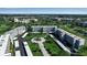 Aerial view of the condo community and golf course, showcasing the lush landscaping and building exteriors at 3860 Ironwood Ln # 503G, Bradenton, FL 34209