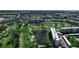 Wide aerial shot featuring water and the property with the golf course and landscaping at 3860 Ironwood Ln # 503G, Bradenton, FL 34209