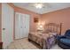 Cozy bedroom featuring tiled flooring and a comfortable lounge chair at 3860 Ironwood Ln # 503G, Bradenton, FL 34209
