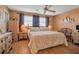 Comfortable bedroom with a ceiling fan and natural light from the window at 3860 Ironwood Ln # 503G, Bradenton, FL 34209