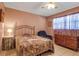 Simple bedroom with neutral walls, a ceiling fan, and tiled flooring at 3860 Ironwood Ln # 503G, Bradenton, FL 34209