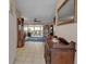 Inviting hallway showcasing tile flooring, decor, and view of the living area at 3860 Ironwood Ln # 503G, Bradenton, FL 34209