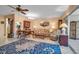 Comfortable living room with a large rug, plush seating, and ample lighting at 3860 Ironwood Ln # 503G, Bradenton, FL 34209