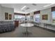 Community meeting room featuring folding tables, chairs, and large windows for natural light at 3860 Ironwood Ln # 503G, Bradenton, FL 34209