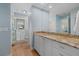 Bathroom features a large granite countertop with white cabinets at 432 Partridge Cir, Sarasota, FL 34236