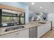 Kitchen with granite countertops, stainless steel appliances, and a view to the outdoor patio at 432 Partridge Cir, Sarasota, FL 34236