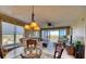 Bright dining area with large windows, golf course views, and elegant furnishings at 4440 Fairways Blvd # 407, Bradenton, FL 34209