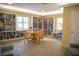 Community library with shelves, a table, chairs, and windows, perfect for reading and studying at 4440 Fairways Blvd # 407, Bradenton, FL 34209