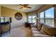 Bright living space features a ceiling fan, large windows with lovely views and comfortable seating at 4440 Fairways Blvd # 407, Bradenton, FL 34209