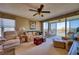 Spacious living room with neutral tones, comfortable seating, and golf course views at 4440 Fairways Blvd # 407, Bradenton, FL 34209