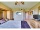 Relaxing bedroom featuring neutral walls, a large bed, built-in storage, and a ceiling fan at 4440 Fairways Blvd # 407, Bradenton, FL 34209