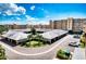 Condo building with parking and landscaping, located on a beautiful property under sunny skies at 4440 Fairways Blvd # 407, Bradenton, FL 34209