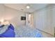 Bright bedroom with neutral walls, TV and large closet doors at 4516 Renwick Dr, Parrish, FL 34219