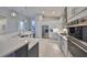 Spacious kitchen featuring stainless steel appliances, a large island, and bright lighting at 4516 Renwick Dr, Parrish, FL 34219