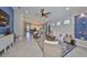 Open-concept living room with stylish decor, comfortable seating, and a seamless flow to the adjacent rooms at 4516 Renwick Dr, Parrish, FL 34219