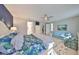 Spacious main bedroom with en-suite bathroom, a ceiling fan, and an accent wall at 4516 Renwick Dr, Parrish, FL 34219