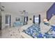 Relaxing main bedroom features a ceiling fan, a seating area, and neutral decor at 4516 Renwick Dr, Parrish, FL 34219