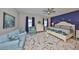 Well-lit main bedroom offers ample space, a comfortable sofa, and tasteful decor at 4516 Renwick Dr, Parrish, FL 34219