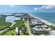 Stunning aerial view showcasing beachfront condos, pristine beaches, and serene waterfront at 4600 Gulf Of Mexico Dr # 202, Longboat Key, FL 34228