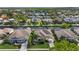 A waterfront property featuring boat docks along a scenic canal, surrounded by manicured lawns at 4616 Blue Marlin Dr, Bradenton, FL 34208