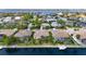 Aerial view of waterfront property with a boat dock and screened lanai at 4616 Blue Marlin Dr, Bradenton, FL 34208