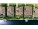 Aerial view of the property showcasing a screened lanai, pool, and waterfront access at 4616 Blue Marlin Dr, Bradenton, FL 34208