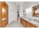 Spacious bathroom with double vanity, granite counters, and custom cabinets offers ample storage at 4616 Blue Marlin Dr, Bradenton, FL 34208